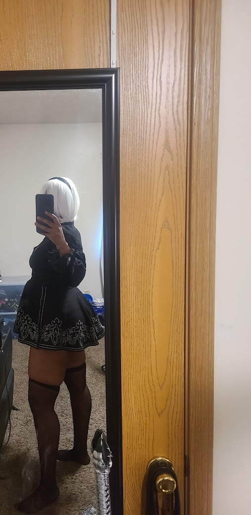 Dressed partially in cosplay costume. 2B Nier Automata.